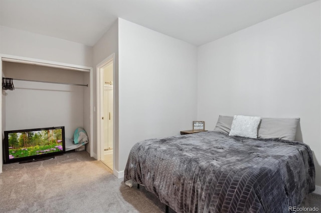 carpeted bedroom with baseboards