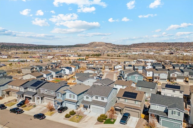 drone / aerial view with a residential view and a mountain view