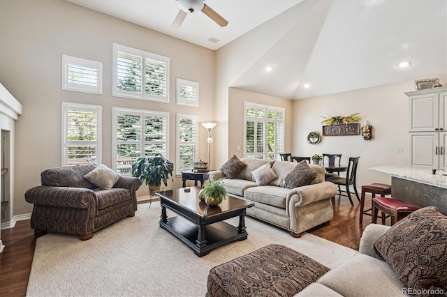 1844 S Jay Way, Lakewood, CO 80232 - living area featuring wood finished floors, a ceiling fan, high vaulted ceiling, baseboards, and recessed lighting