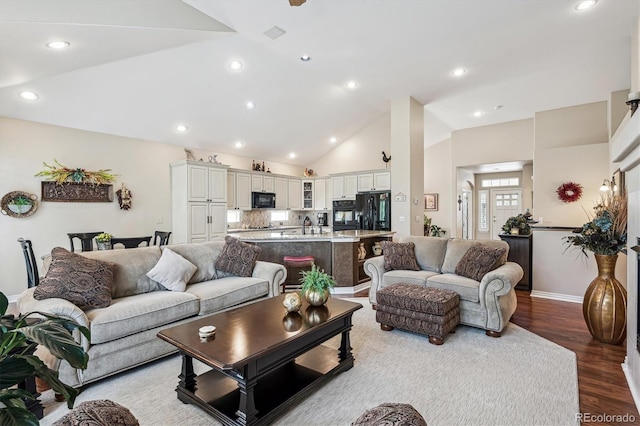 1844 S Jay Way, Lakewood, CO 80232 - living area featuring recessed lighting, baseboards, high vaulted ceiling, and wood finished floors