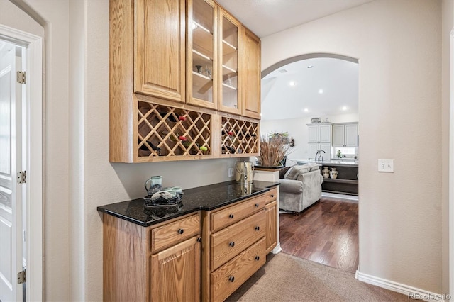 1844 S Jay Way, Lakewood, CO 80232 - bar featuring a bar, dark colored carpet, arched walkways, and recessed lighting