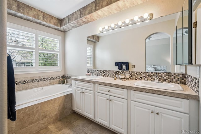 1844 S Jay Way, Lakewood, CO 80232 - bathroom featuring a bath, tile patterned flooring, ceiling fan, and a sink