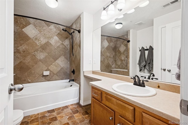 8778 S Kipling Way Unit 304, Littleton, CO 80127 - full bathroom with vanity, washtub / shower combination, and toilet