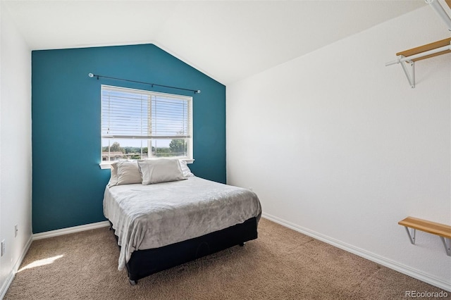 8778 S Kipling Way Unit 304, Littleton, CO 80127 - carpeted bedroom featuring lofted ceiling and baseboards