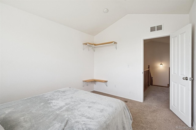 8778 S Kipling Way Unit 304, Littleton, CO 80127 - bedroom featuring lofted ceiling, carpet flooring, and baseboards