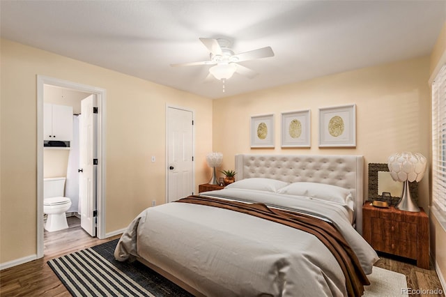 bedroom featuring dark hardwood / wood-style flooring, connected bathroom, and ceiling fan