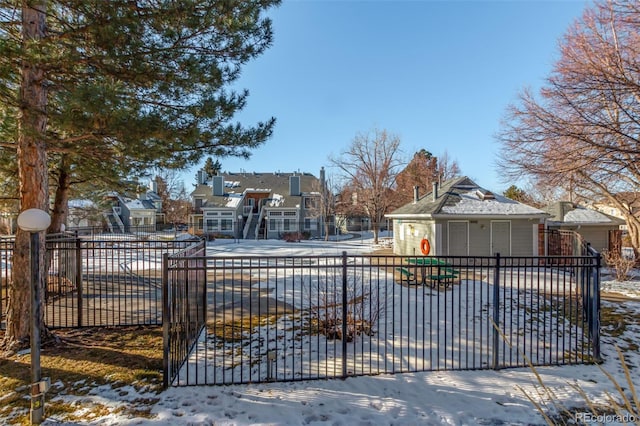 view of snow covered gate