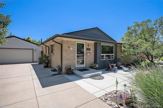 6868 S Birch Way, Centennial, CO 80122 - ranch-style home featuring brick siding, an outbuilding, and a detached garage
