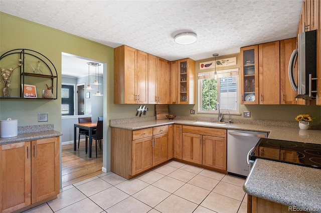 6868 S Birch Way, Centennial, CO 80122 - kitchen with appliances with stainless steel finishes, brown cabinets, glass insert cabinets, and light tile patterned floors