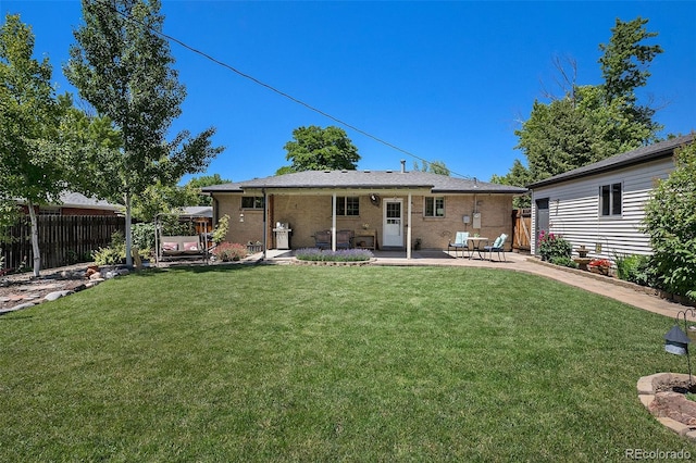 6868 S Birch Way, Centennial, CO 80122 - back of house featuring a patio and brick siding
