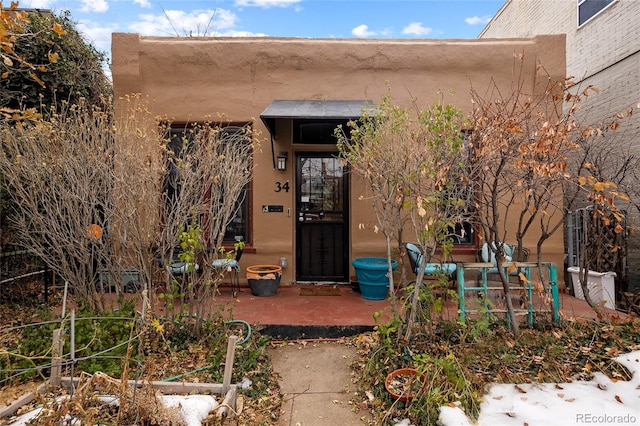 entrance to property with a patio area