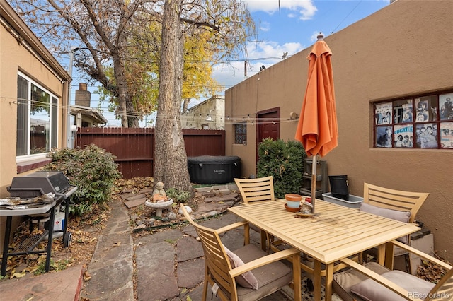 view of patio featuring area for grilling and a hot tub