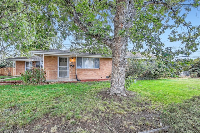5563 Newland Way, Arvada, CO 80002 - single story home featuring brick siding