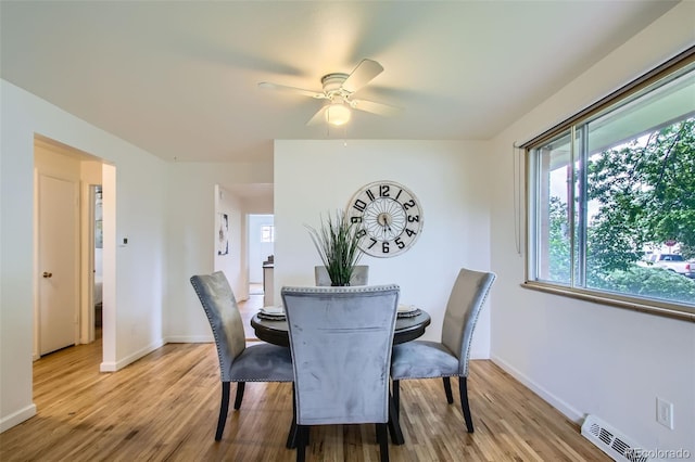 5563 Newland Way, Arvada, CO 80002 - dining room with light wood-style flooring and a ceiling fan