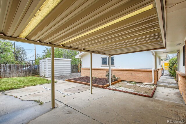 5563 Newland Way, Arvada, CO 80002 - fenced backyard featuring a patio and a storage shed
