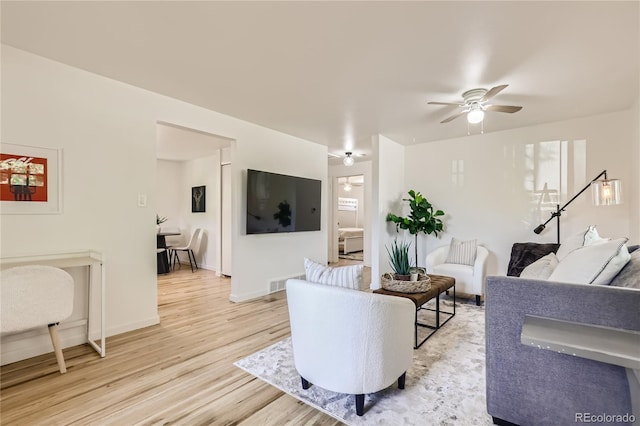 5563 Newland Way, Arvada, CO 80002 - living room featuring light wood-style floors and a ceiling fan