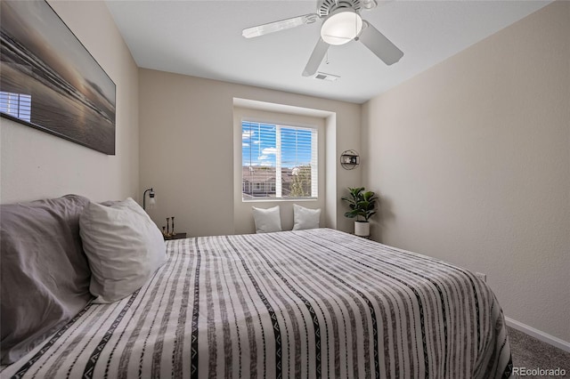 bedroom featuring ceiling fan and carpet