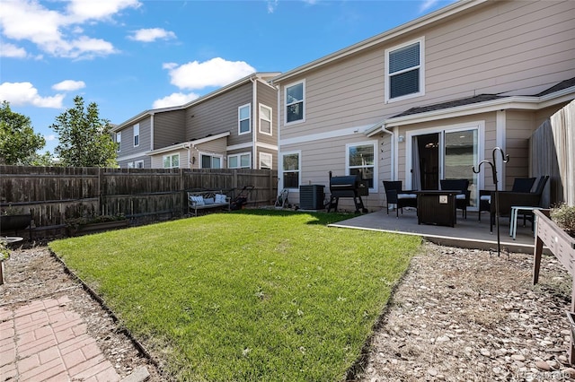 back of house with a yard, a patio area, and central air condition unit