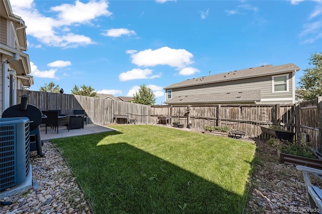 view of yard featuring a patio and cooling unit