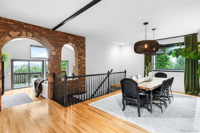 600 Cascade Dr, Golden, CO 80403 - dining area with wood finished floors, plenty of natural light, and arched walkways