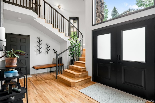600 Cascade Dr, Golden, CO 80403 - entryway with a towering ceiling, stairs, wood-type flooring, and french doors