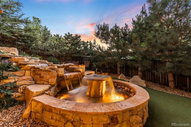 600 Cascade Dr, Golden, CO 80403 - patio terrace at dusk featuring an outdoor fire pit