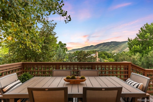 600 Cascade Dr, Golden, CO 80403 - deck at dusk featuring outdoor dining space and a mountain view