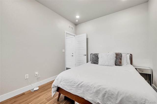 1575 W 68th Ave, Denver, CO 80221 - bedroom with wood finished floors and recessed lighting
