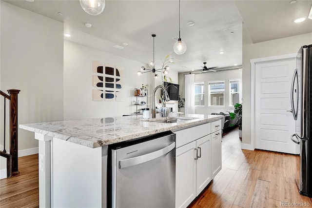1575 W 68th Ave, Denver, CO 80221 - kitchen featuring dishwasher, freestanding refrigerator, light stone countertops, white cabinets, and recessed lighting
