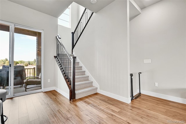 1575 W 68th Ave, Denver, CO 80221 - foyer entrance with light wood-style flooring and stairway