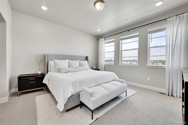 1575 W 68th Ave, Denver, CO 80221 - bedroom with light carpet, multiple windows, and recessed lighting