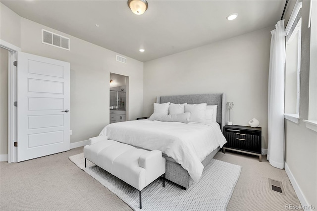 1575 W 68th Ave, Denver, CO 80221 - bedroom featuring light carpet, ensuite bath, and recessed lighting
