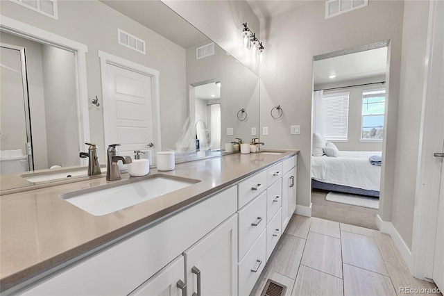 1575 W 68th Ave, Denver, CO 80221 - bathroom with double vanity, connected bathroom, and tile patterned floors