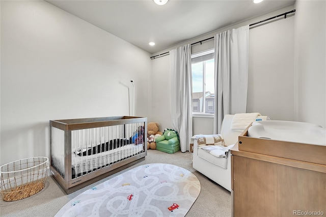 1575 W 68th Ave, Denver, CO 80221 - carpeted bedroom with a crib and recessed lighting