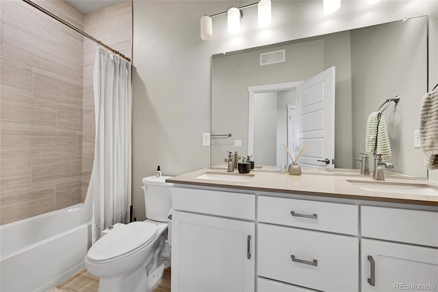 1575 W 68th Ave, Denver, CO 80221 - full bathroom with double vanity, shower / tub combo with curtain, and wood finished floors