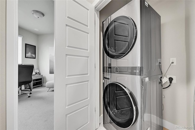 1575 W 68th Ave, Denver, CO 80221 - laundry area featuring stacked washing machine and dryer and carpet