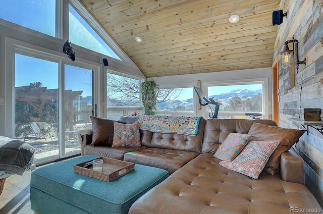 living room featuring wood ceiling, a mountain view, high vaulted ceiling, and a wealth of natural light