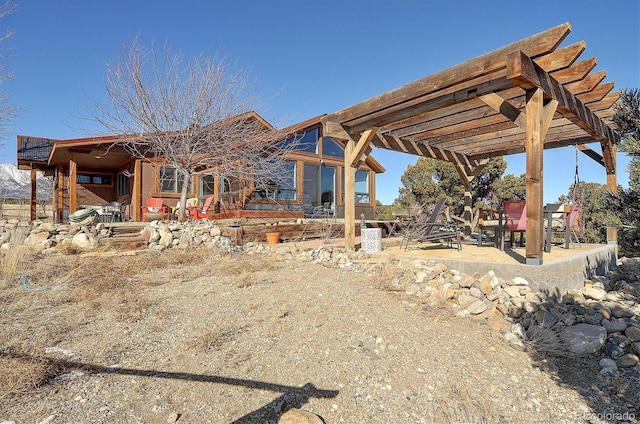 back of property with a patio and a pergola