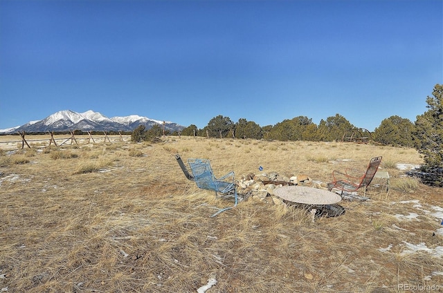 view of yard featuring a rural view and a mountain view