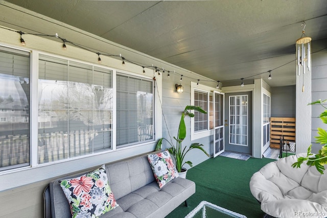 sunroom featuring an outdoor living space