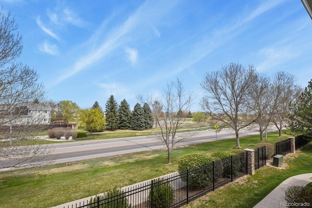 exterior space featuring a yard and fence