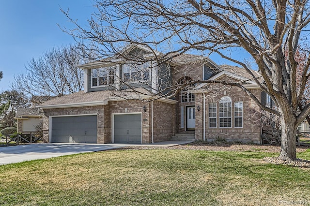 traditional-style house with a garage, a front yard, brick siding, and concrete driveway