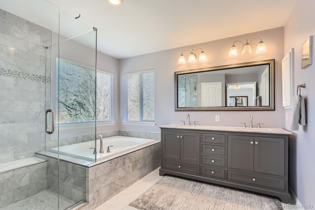 full bathroom featuring double vanity, a bath, a sink, and a stall shower
