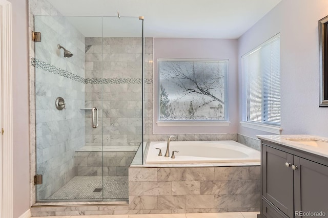 full bath featuring a shower stall, a bath, and vanity