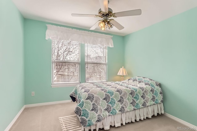 bedroom with carpet, baseboards, and ceiling fan