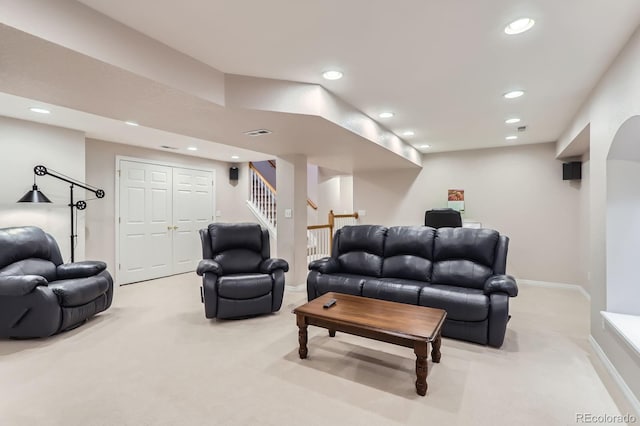 living room featuring light carpet, visible vents, and recessed lighting