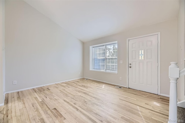 1758 S Ensenada St, Aurora, CO 80017 - foyer featuring light wood-style floors, vaulted ceiling, and baseboards