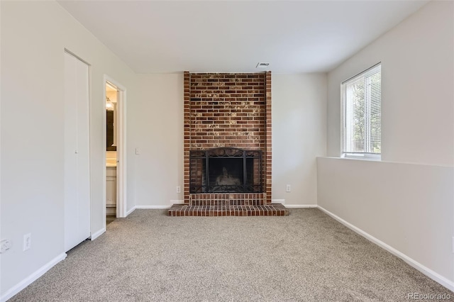 1758 S Ensenada St, Aurora, CO 80017 - unfurnished living room with carpet floors, a fireplace, and baseboards