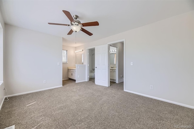 1758 S Ensenada St, Aurora, CO 80017 - unfurnished bedroom with carpet floors, baseboards, ensuite bathroom, and a ceiling fan