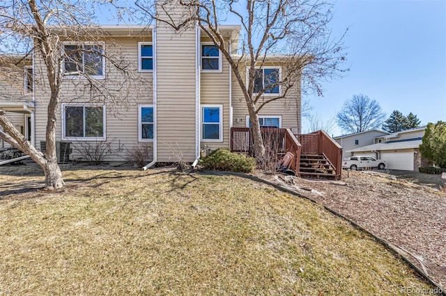 exterior space with a yard and a wooden deck